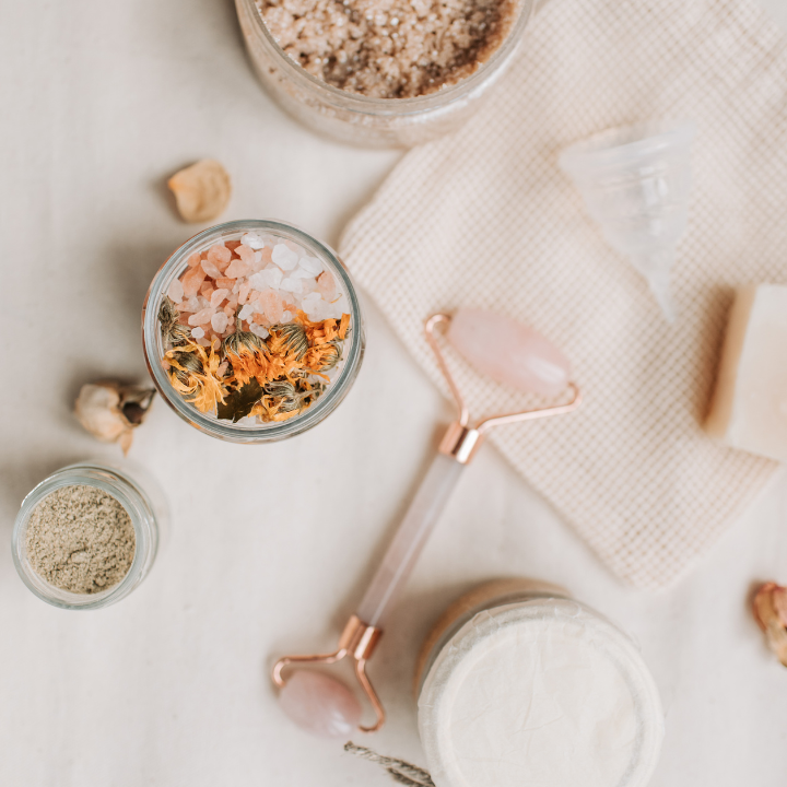 Teens and tweens enjoying a hands-on DIY skincare birthday party workshop in Adelaide, creating natural products like lip balm and body scrubs using safe, kid-friendly ingredients.
